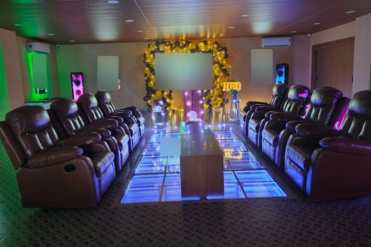 Private party hall with LED dance floor and recliners at Coral Hotel, Vizag, for a Diwali family party