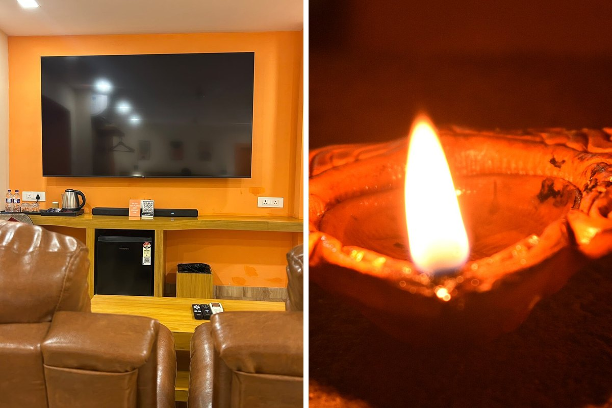 Night private theatre with twin recliners at Coral Hotel, beside a lit Diwali diya