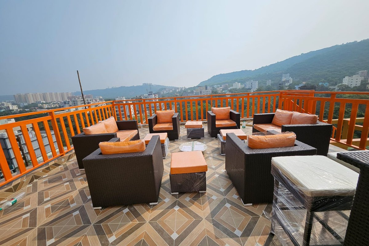 Rooftop lounge sofas and city view at The View, Coral Hotel, Madhurawada